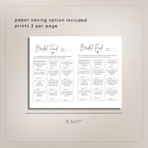 May include: Two printable bridal shower game cards with the title "Bridal Fund" and a heart symbol. The cards are black and white and feature a grid of 24 squares with questions for guests to answer. The cards are 8.5 inches by 11 inches.