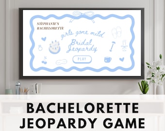 May include: A framed digital display shows a light blue and white "Bridal Jeopardy" game. The game's title is in a decorative frame with illustrations of a cake, cherries, and champagne. The text "Stephanie's Bachelorette" is at the top.
