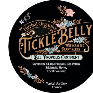 May include: A vintage-style label for Tickle Belly Bee Propolis Ointment. The label features a gold and brown logo with floral accents. The product description includes ingredients like sunflower oil, bee propolis, bee pollen, manuka honey, and beeswax. The label also states that the product is for topical use only and is 2 ounces.
