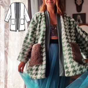 May include: A white and green patterned cardigan with brown fleece pockets. The cardigan has a long, open front and a sash.