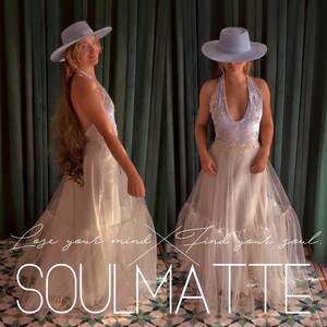 May include: A light blue wide-brimmed hat paired with a floor-length halter dress featuring a white bodice with floral embroidery and a layered tulle skirt. The text "Lose your mind. Find your soul. SOULMATTE" is overlaid on the image.