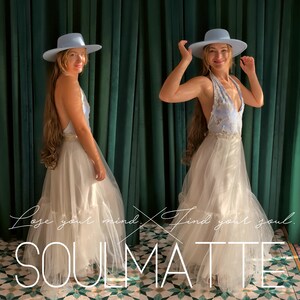 May include: A light blue wide-brimmed hat paired with a floor-length dress featuring a light blue bodice with white floral embroidery and a layered white tulle skirt. The text "Lose your mind. Find your soul. SOULMATTE" is overlaid on the image.