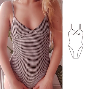 May include: A black and white striped swimsuit with thin straps and a V-neckline. The one-piece bathing suit has a classic design and is shown with a line drawing of the swimsuit. The swimsuit is a stylish choice for swimwear.