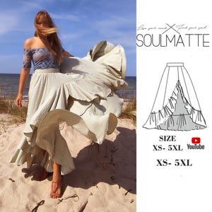 May include: A woman wearing a light green and white gingham maxi skirt with a ruffled hem. The skirt is flowing in the wind and the woman is standing on a sandy beach. The text "Lose your mind, find your soul, SOULMATTE" is visible in the image. The text "SIZE XS-5XL YouTube XS-5XL" is also visible in the image.