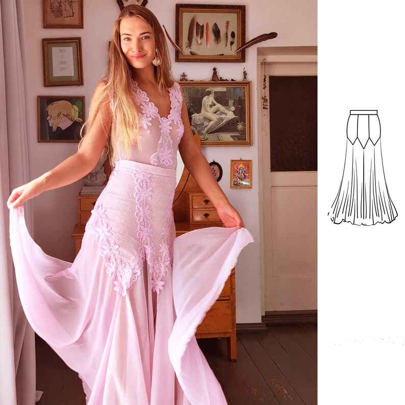 May include: A light pink maxi dress with a lace bodice and a flowing skirt. The dress has a V-neckline and sleeveless design. The skirt is gathered at the waist and has a slight A-line shape.