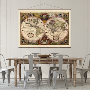 May include: A vintage world map print hangs above a rustic wooden table with four gray metal chairs. The map is framed in a simple wooden frame and features intricate details and colorful accents.