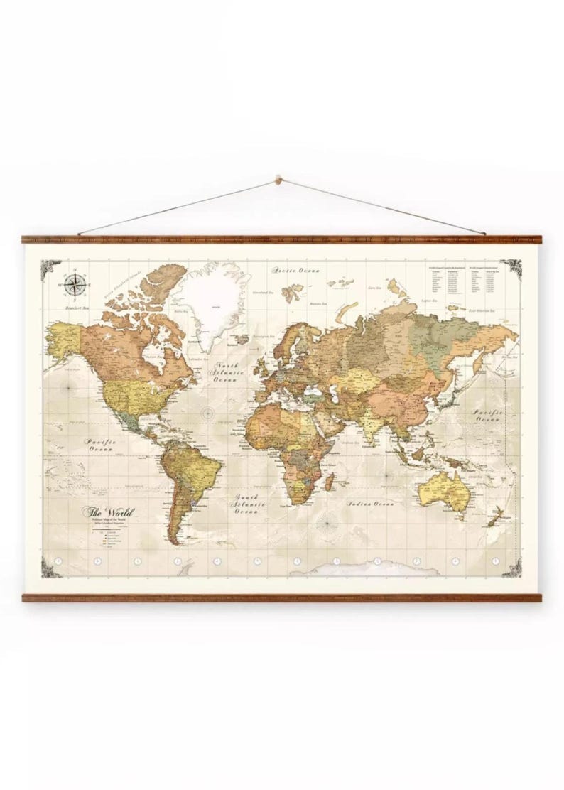 The image is a large world map hanging on a wall.
