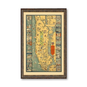 May include: A vintage illustrated map of Manhattan, New York City, framed in a brown wood frame. The map is in a cartoon style and shows various landmarks and points of interest.