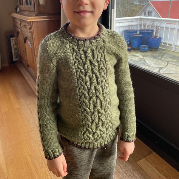 Little Cassiope Sweater. Handmade knitted jumper with braids in 100% Merino wool
