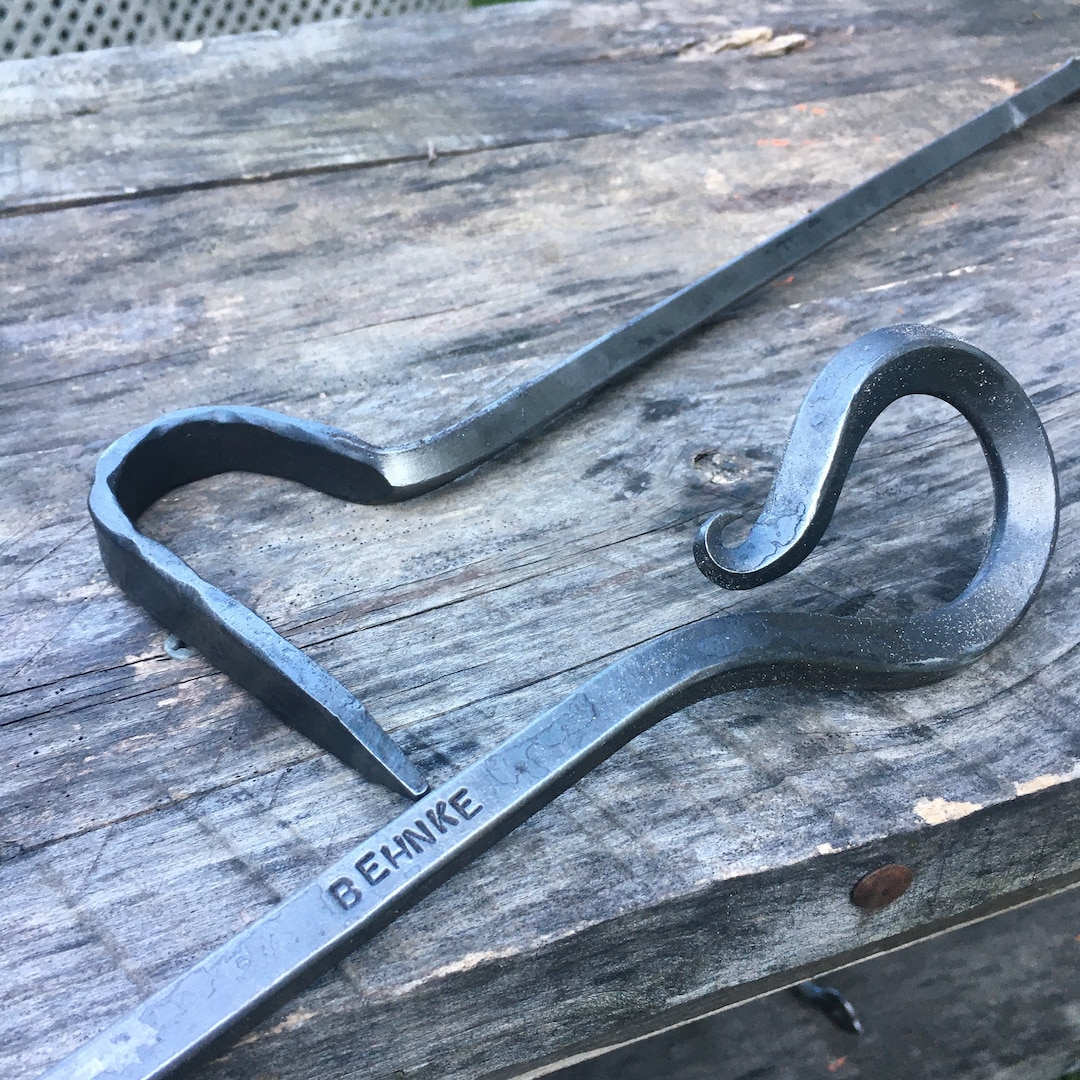 Personalized Fire Poker Hand by a Blacksmith Bonfire and