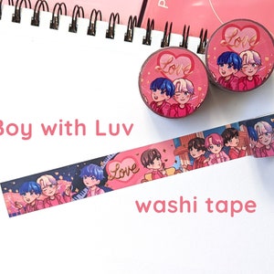 May include: Washi tape featuring a group of cartoon boys in pink and blue outfits with the words "Boy with Luv" and "Love" on the tape.
