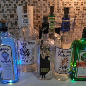 Upcycling spirits bottles with lights ... good night light in bar area/great for light outside on the table