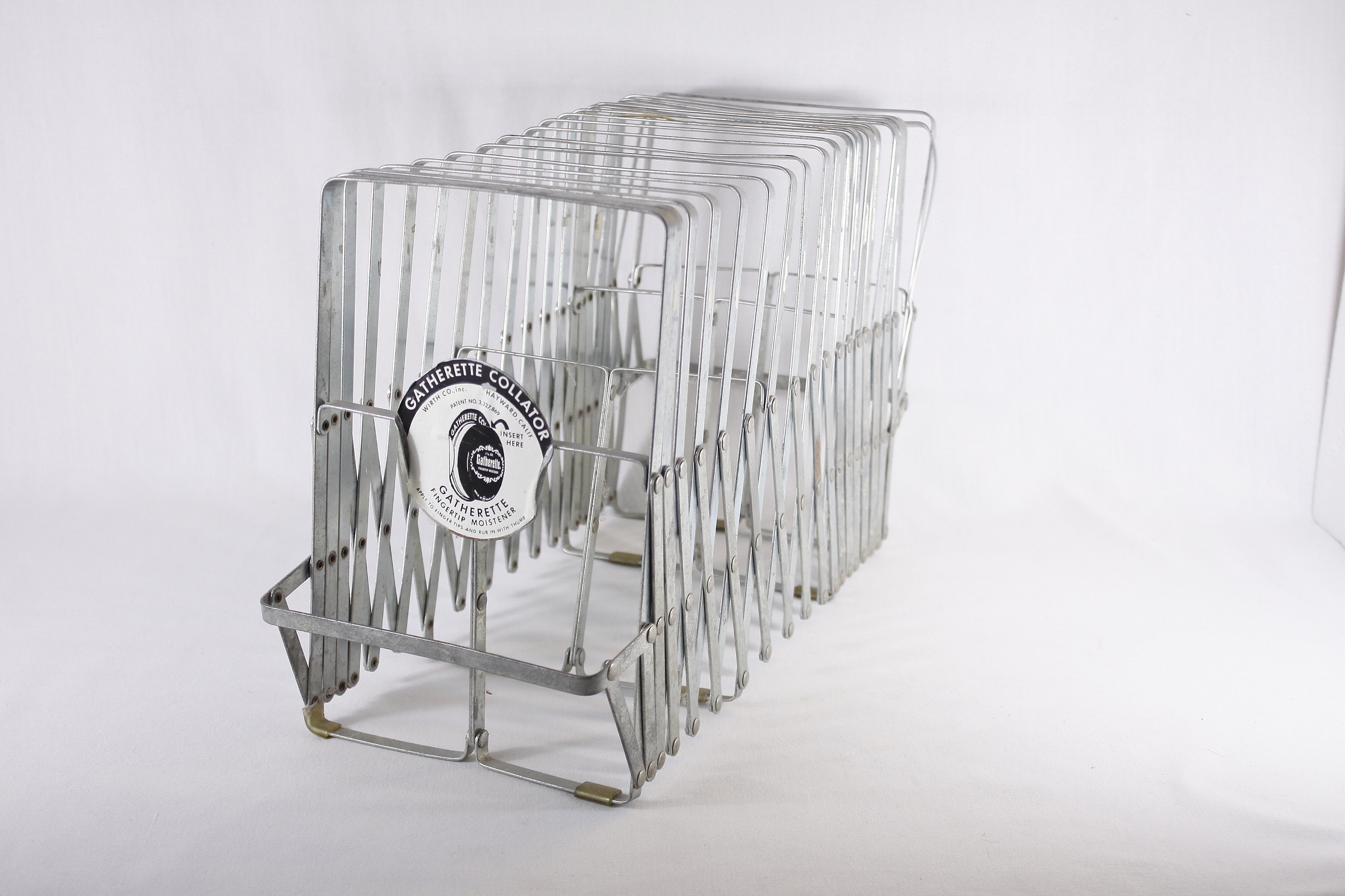 Metal expanding file outlet