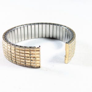 Worn Stretchy Speidel USA Satin gold watch strap 15mm wide, 1/20 10K Gold filled top caps, stainless steel mens watch strap wrist band