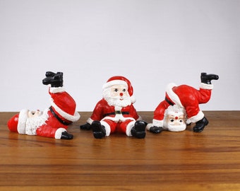 1990s tumbling Santa figurines set of 3 by Novelino Irvine CA, silly funny holiday home decor, Christmas Santa Claus decor figurines