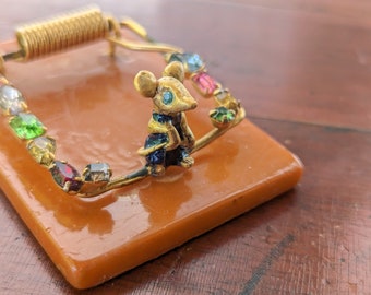 Vintage butterscotch bakelite mousetrap notebook holder with rhinestones, memo receipt clip