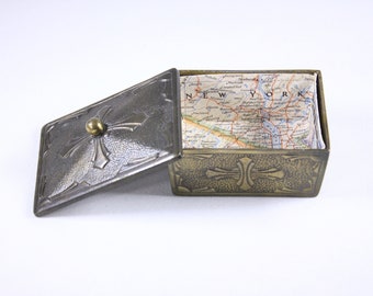 Small metal trinket box, watch box, jewelry casket lined with map