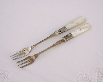 Antique pickle forks with mother of pearl handles, electro plated trident serving forks