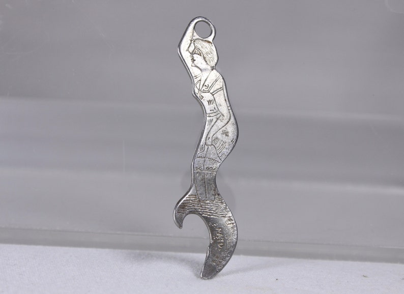 1920s Pitzls Famous Beer antique mermaid beer bottle opener, lady bather Souris Breweries Ltd Estevan Saskatoon image 1