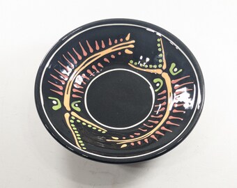 Vintage Black Art Studio plate by Lewis, fossil or insect pattern neon on black