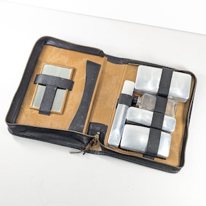 Ca 1940s Black leather gentleman's toiletry travel set, Dopp kit grooming set metal USA containers