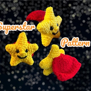 May include: Three crocheted yellow stars with red accents. The stars have smiling faces and are arranged in a cluster. The image is labelled "Superstar Pattern".