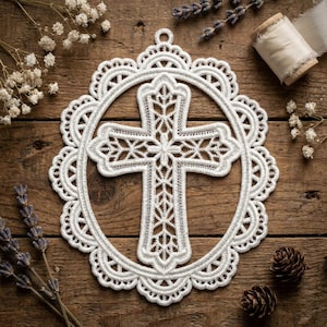May include: A white, intricately designed cross within a circular frame, crafted from delicate lace. The cross features detailed patterns and is surrounded by a scalloped edge. The background is a rustic wooden surface, with sprigs of lavender and white flowers.
