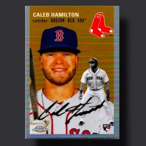 May include: Baseball trading card featuring Caleb Hamilton, catcher for the Boston Red Sox. The card has a photo of Hamilton in a Red Sox uniform and a smaller image of him in action. The card also includes the Red Sox logo and a signature.