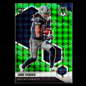 May include: A Simi Fehoko Dallas Cowboys football trading card. The card features a player in a Cowboys uniform, holding a football. The background is a mosaic of green and black. The card has the RC logo.