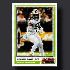 May include: A trading card featuring Demario Davis of the New Orleans Saints in a white uniform with the number 56. The card has a green border and the text "ACTION ALL-STARS" and "DEMARIO DAVIS • NFC" is visible.
