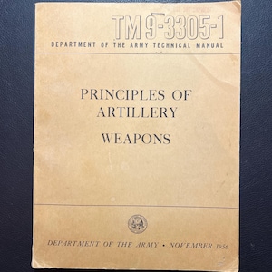 May include: A tan-colored book with the title "TM 9-3305-1" and the text "DEPARTMENT OF THE ARMY TECHNICAL MANUAL" printed on the cover. The book also has the title "PRINCIPLES OF ARTILLERY WEAPONS" and the text "DEPARTMENT OF THE ARMY  NOVEMBER 1956".