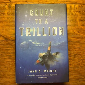 May include: A hardcover book titled Count to a Trillion by John C. Wright. The dark blue cover features a space scene with a large spacecraft and a smaller fighter jet. The text reads: Count to a Trillion, John C. Wright, and a quote by Spider Robinson.