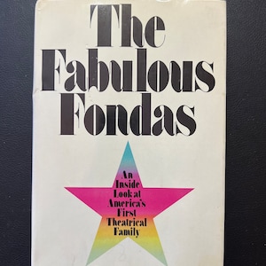 May include: A book cover with the title "The Fabulous Fondas" in bold black letters. The cover features a large pink, yellow, and blue star with the text "An Inside Look at America's First Theatrical Family" inside. The author's name, "James Brough", is printed in black at the bottom of the cover.