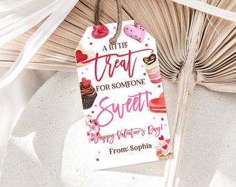 May include: A white gift tag with pink and red hearts and a watercolor illustration of various sweets. The tag reads "A little treat for someone sweet! Happy Valentine's Day! From: Sophia".
