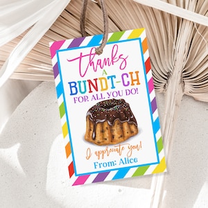 May include: A colorful thank you tag with a rainbow striped border. The tag features a cartoon illustration of a chocolate bundt cake with sprinkles and the text "Thanks a Bundt-ch for all you do! I appreciate you! From: Alice".