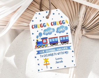 May include: A white thank you tag with a blue train and red, yellow, and blue clouds. The text on the tag reads "Chugga Chugga Thank Choo" and "For coming aboard to celebrate with me! Love, Jacob".