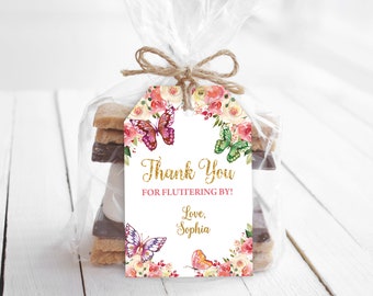 May include: A white thank you tag with gold glitter text that says "Thank You for Fluttering By! Love, Sophia". The tag is decorated with watercolor pink and yellow flowers and butterflies.