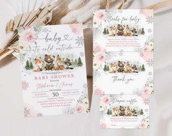 Op de afbeelding: Een roze en witte babyborrel uitnodiging met een winterbos thema. De uitnodiging toont een beer, vos, hert en wasbeer in een besneeuwd bos. De tekst luidt "Baby it's cold outside" en bevat de namen "Stephanie & James".