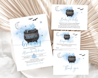 May include: A baby shower invitation with a blue and white watercolor background featuring a black cauldron with blue smoke and stars. The text "A baby is brewing" is written in a whimsical font. The invitation includes the name "Alexandra Anderson" and details for the event, including the date, time, and location.