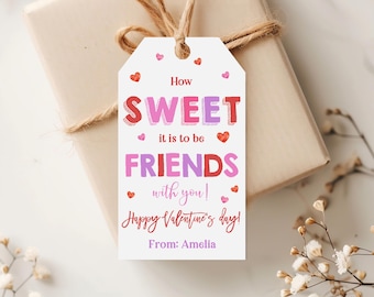 May include: A Valentine's Day gift tag with the message "How SWEET it is to be FRIENDS with you! Happy Valentine's day!" in red, pink, and purple. The tag is attached to a wrapped gift with twine.
