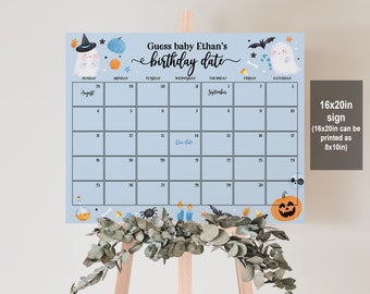 May include: A blue and white calendar with a Halloween theme. The calendar is decorated with ghosts, pumpkins, bats, and candy corn. The calendar is for guessing baby Ethan's birthday date. The calendar is 16x20 inches and can be printed as 8x10 inches.