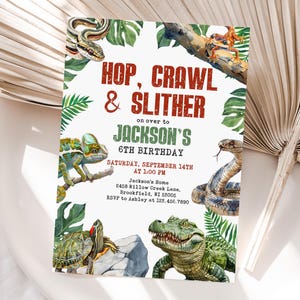 May include: A birthday party invitation with the text "Hop, Crawl & Slither" in red and green. The invitation features watercolor illustrations of a snake, chameleon, turtle, alligator, and frog. The invitation is for Jackson's 6th birthday.