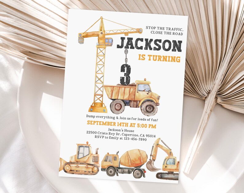 May include: A construction-themed birthday invitation featuring a yellow crane lifting a dump truck with the number 3. The invitation includes the text "JACKSON IS TURNING" and event details. Additional construction vehicles are at the bottom.