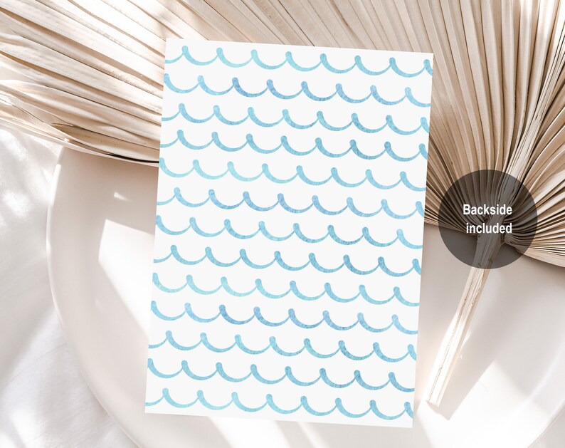 May include: A white card with a blue watercolor wave pattern. The back side of the card is included.