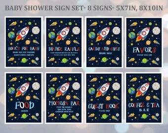 May include: Set of eight printable baby shower signs featuring a rocket ship and planets on a dark blue background with stars. The signs include titles such as "Books for Baby", "Diaper Raffle", "Cards and Gifts", "Favors", "Food", "Mimosa Bar", "Guest Book", and "Coffee & Tea Bar".