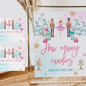 May include: Two pink and blue printable game cards with a Nutcracker and ballerina theme. The cards ask "How many candies are in the jar?" and have lines for guests to write their guesses and names.