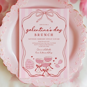 May include: A pink Galentine's Day brunch invitation with a decorative border and bow design. The invitation includes text with event details, such as the date, time, and location. The invitation is on a pink plate with a floral design.