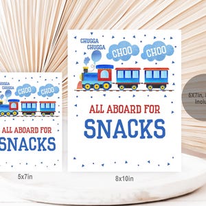 May include: Two printable signs featuring a cartoon train with the text "All Aboard for Snacks" in blue and red. The larger sign is 8x10 inches and the smaller sign is 5x7 inches.
