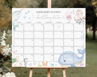 May include: A blue and white calendar with a nautical theme. The calendar is decorated with a narwhal, an octopus, a whale, and other sea creatures. The calendar is for guessing a baby's birthday date. The text on the calendar says "Guess Baby Oliver's Birthday Date".