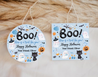 May include: Two blue and white Halloween treat tags with a ghost, black cat, and pumpkin design. The text on the tags reads "Boo! Here is a treat for you! Happy Halloween Your friend, Oliver".